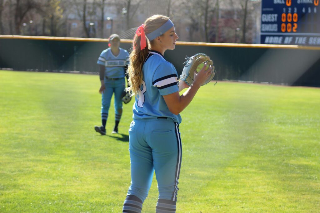 Softball player warming up before a big game