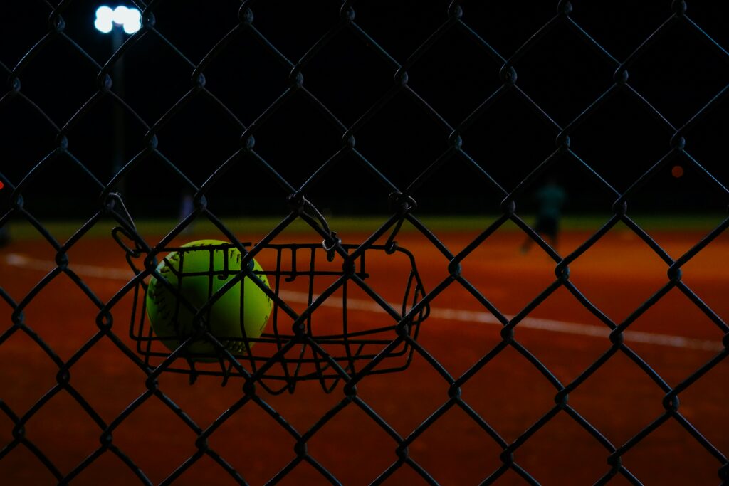 Fence behind a softball diamond